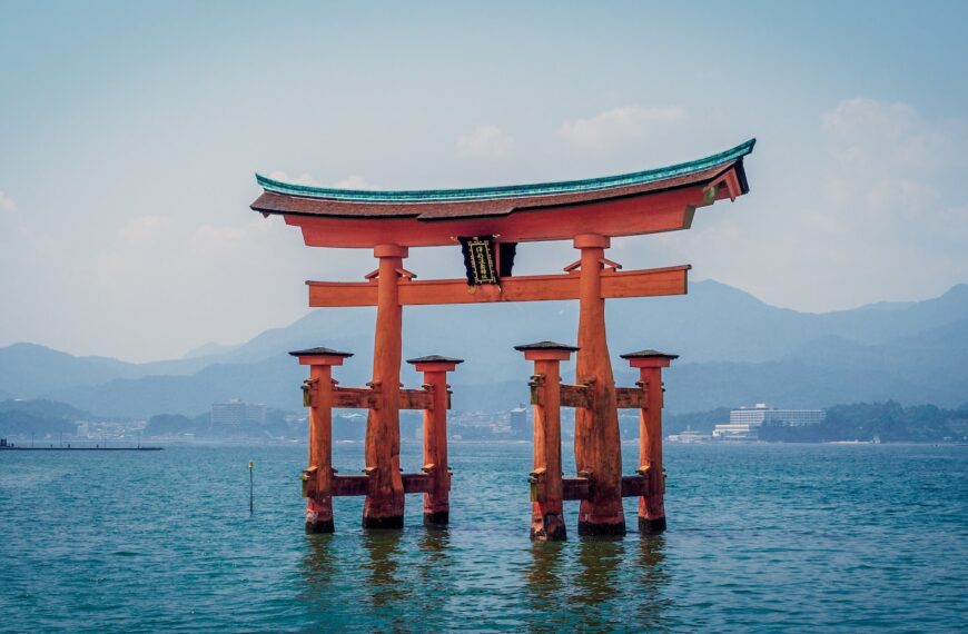 red shrine in body of water